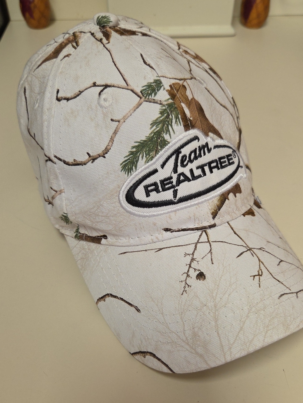 Realtree White Camo Cap with Brown and Green Accents